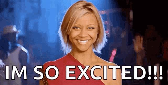 a woman in a red dress is smiling and saying i 'm so excited !