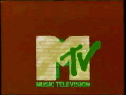 a pink and blue mtv logo is on a brown background