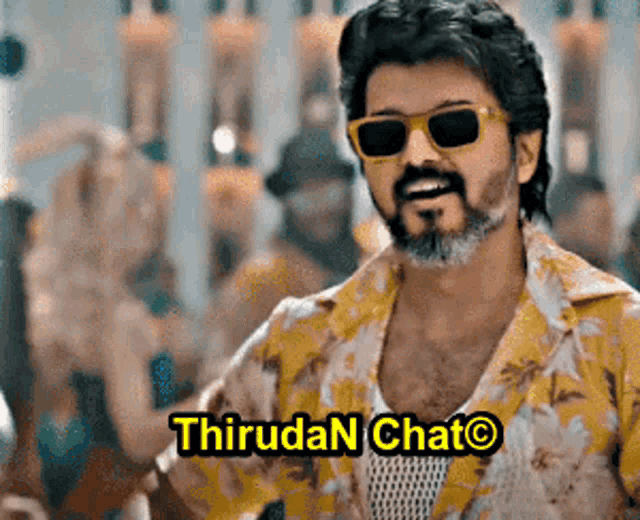 a man wearing sunglasses and a yellow shirt with the words thiruda chat written on it .