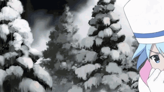 a girl in a white hat is standing in front of a snow covered forest .