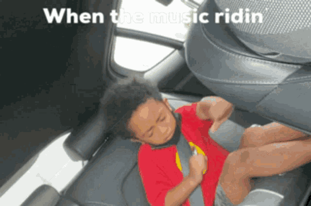 a little boy is sleeping in the back seat of a car with the words " when the music ridin " written above him