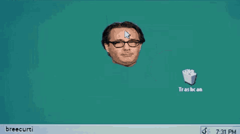 a computer screen with a trashcan and a man 's face