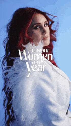a woman with red hair is featured in a glamour women of the year advertisement