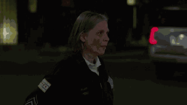 a woman in a chicago uniform is smiling