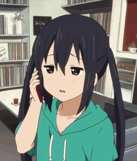 a girl with pigtails is talking on a phone