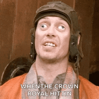 a man is wearing a helmet and making a funny face .