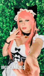 a woman with pink hair is wearing a maid costume and the name brooklynbones is on the bottom
