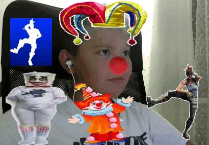 a boy wearing a jester hat and a clown nose