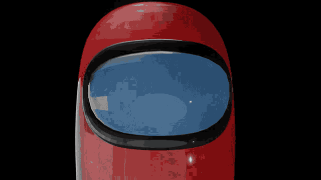 a red among us character with a santa hat on his head