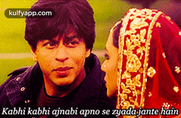 a picture of a man and a woman with a caption that says kabhi kabhi ajnabi
