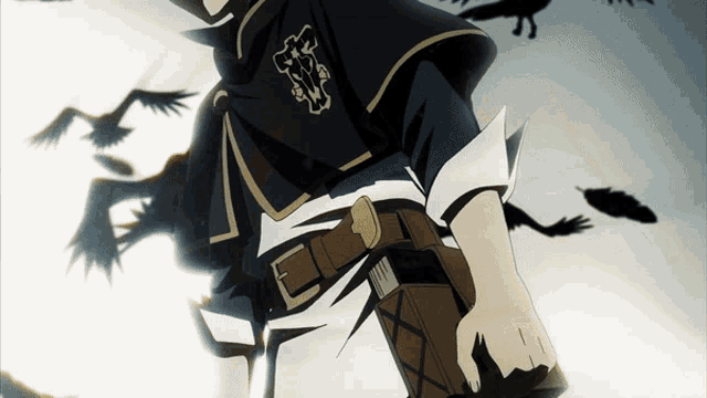 a man in a black cape with a cross on it