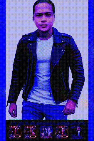 a man in a leather jacket and white shirt is standing in front of a blue background