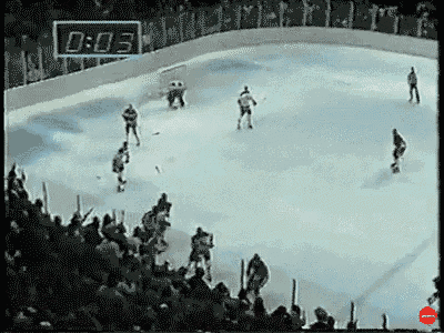 a hockey game is being played in front of a crowd and a clock that says 0:03
