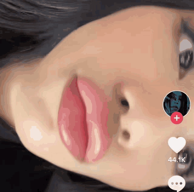 a close up of a woman 's face with the number 44.1k on the bottom right corner