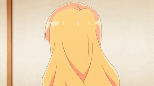 a girl with blonde hair is wearing a green dress and a yellow bow