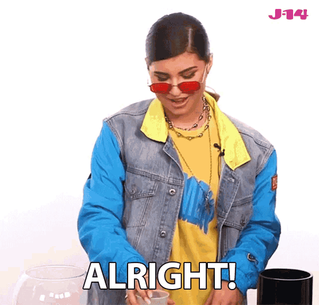 a woman wearing red sunglasses and a denim jacket says alright