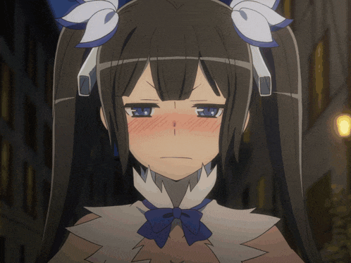 a close up of a girl with a blue bow on her neck