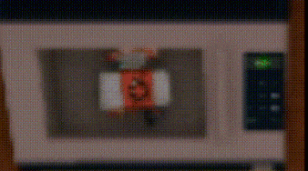 a close up of a microwave with a cartoon in it