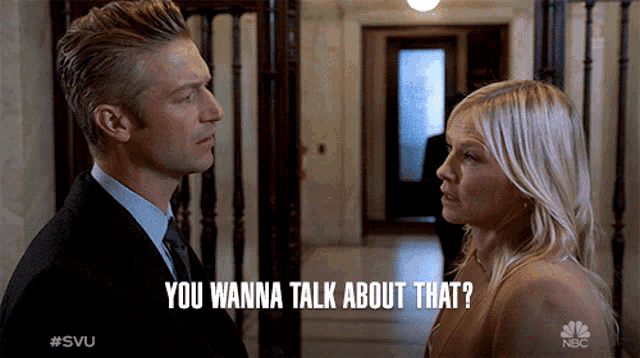 a man and a woman are looking at each other and the man says you wanna talk about that