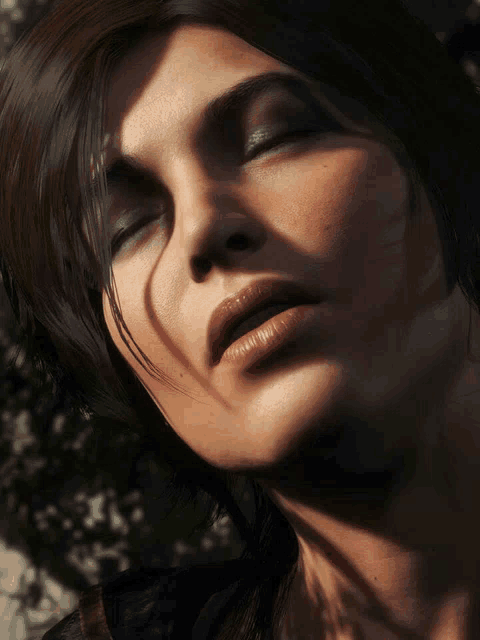 a close up of a woman 's face with closed eyes