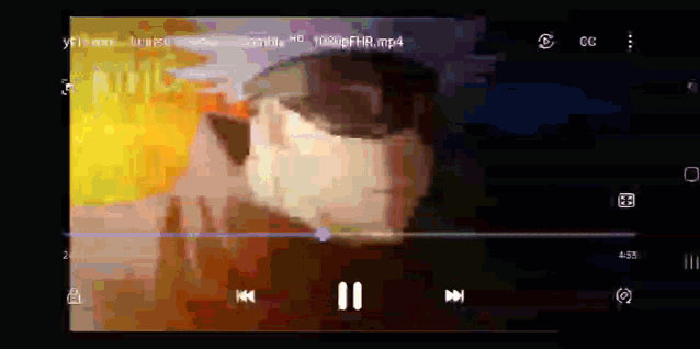 a video is being played on a phone with a pause button on the bottom right