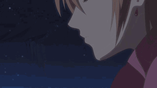 a man and a woman are kissing in a anime scene