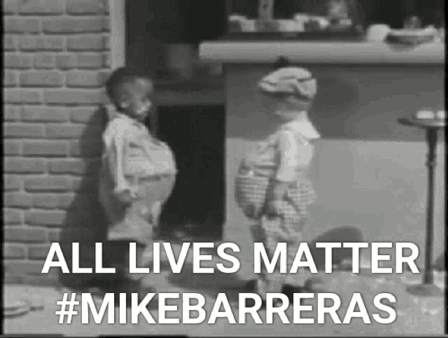 a black and white photo of two children standing next to each other with the caption " all lives matter #mikebarreras "