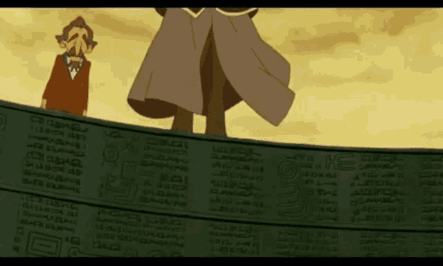 a man in a red coat stands in front of a wall with arabic writing