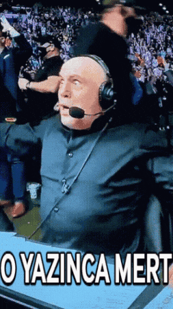 a man wearing a headset says " o yazunca mert "