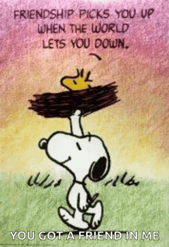 snoopy is holding a piece of wood on his head with a quote .