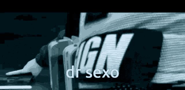 a man is standing in front of a sign that says dr sexo .