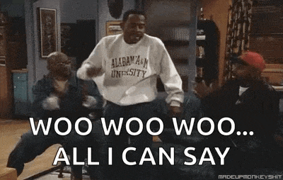 a group of men are dancing in a living room and one of them is wearing a sweatshirt that says alabama university .