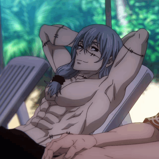 a man with stitches on his arm is laying on a beach chair