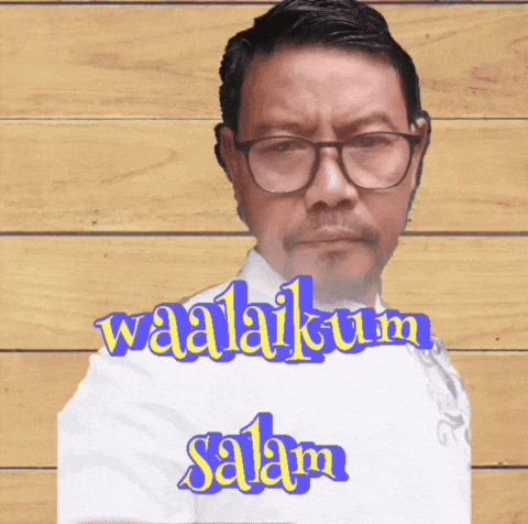 a man wearing glasses and a white shirt with the words waalaikum salam written on it