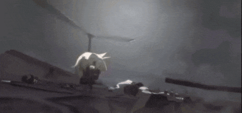 a helicopter is flying through a dark room with a person laying on the ground .