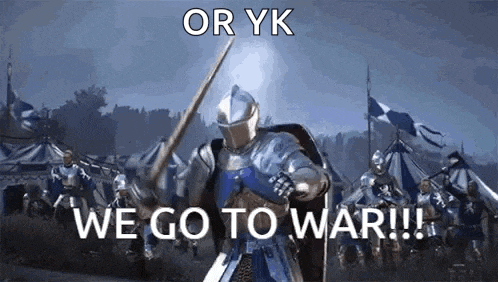 a knight in armor is holding a sword and shield in front of a crowd of knights .