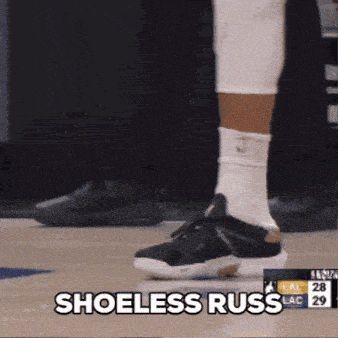 a basketball player says shoeless russ while walking on the court