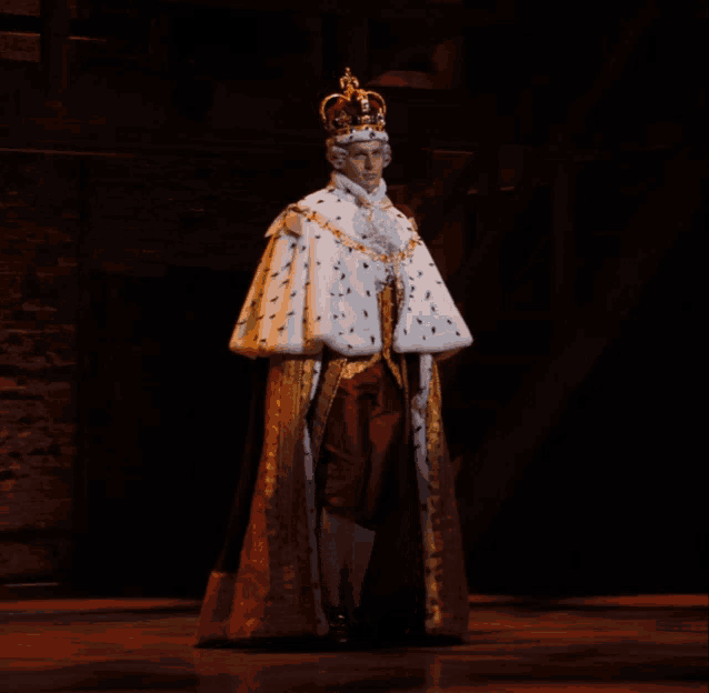 a man dressed as a king with a crown