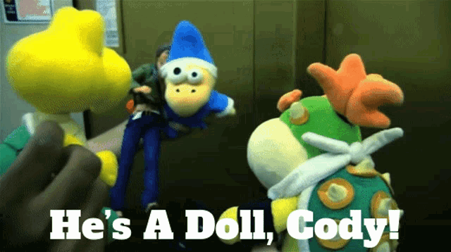 a person holding a stuffed animal with the words he 's a doll gody on it