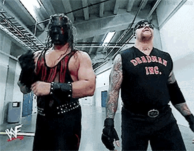 Undertaker Kane GIF - Undertaker Kane Evil GIFs