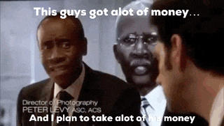 two men in suits and ties are talking to each other .