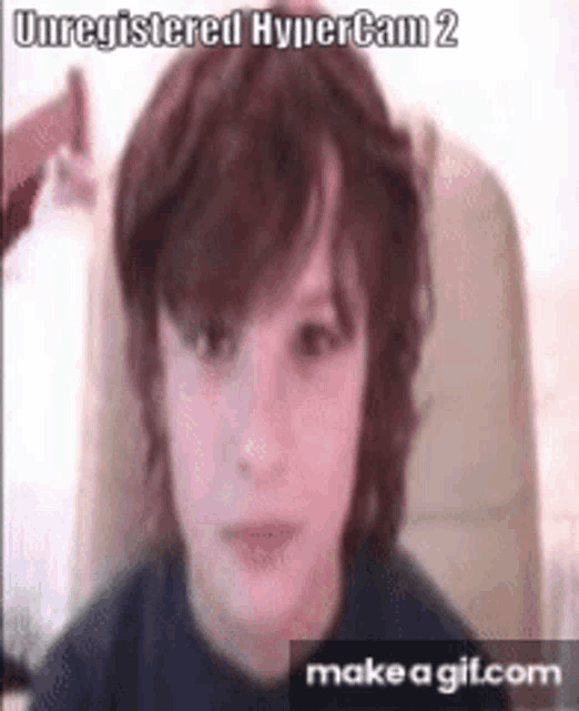 a young boy 's face is shown in an unregistered hypercam 2 video .