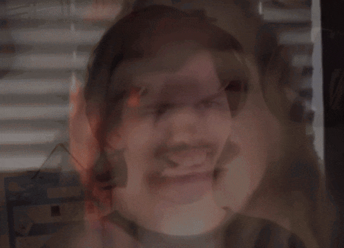 a blurred image of a man 's face with the words " allthingsfrost " on the bottom right