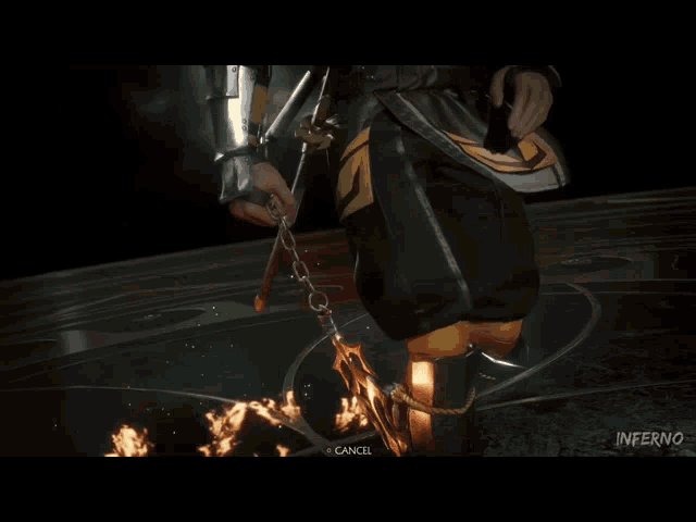 a man in armor is holding a sword in front of a fire in a video game .
