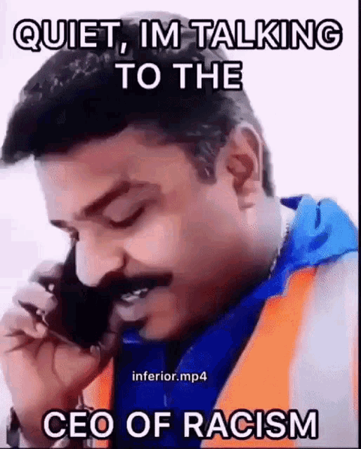 a man is talking on a cell phone with a caption that says quiet , im talking to the ceo of racism