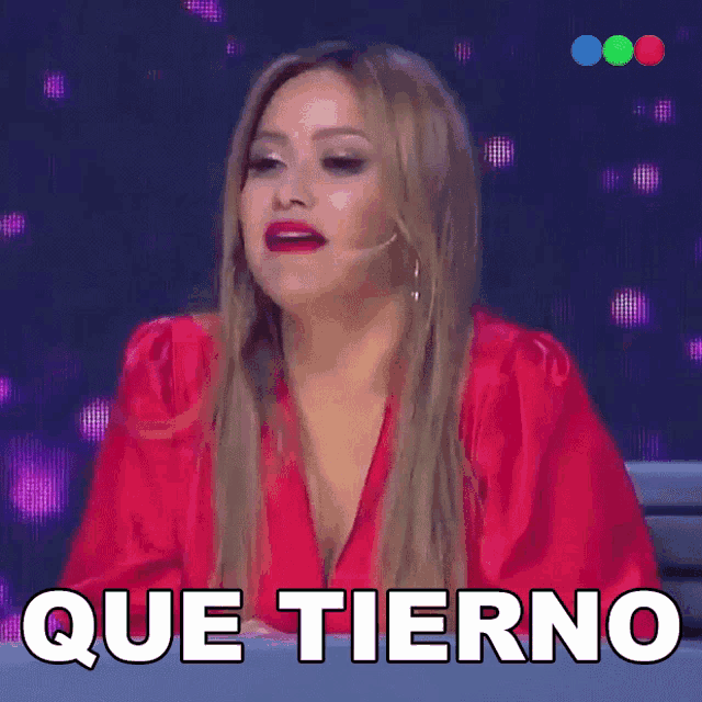 a woman in a red dress says que tierno