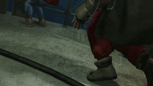 a person 's foot is being kicked by another person 's foot