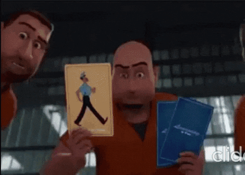 a man in a jail cell is holding a card with a police officer on it .
