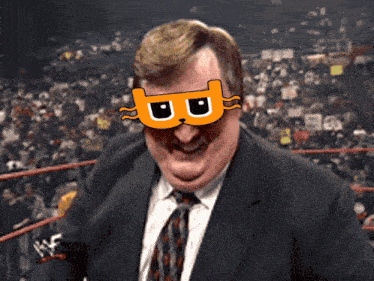 a man in a suit and tie is wearing a mask with a cat on it