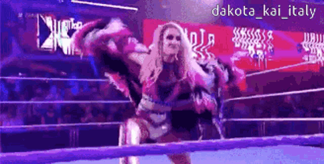 a woman in a wrestling ring with the name dakota kai italy on the bottom right